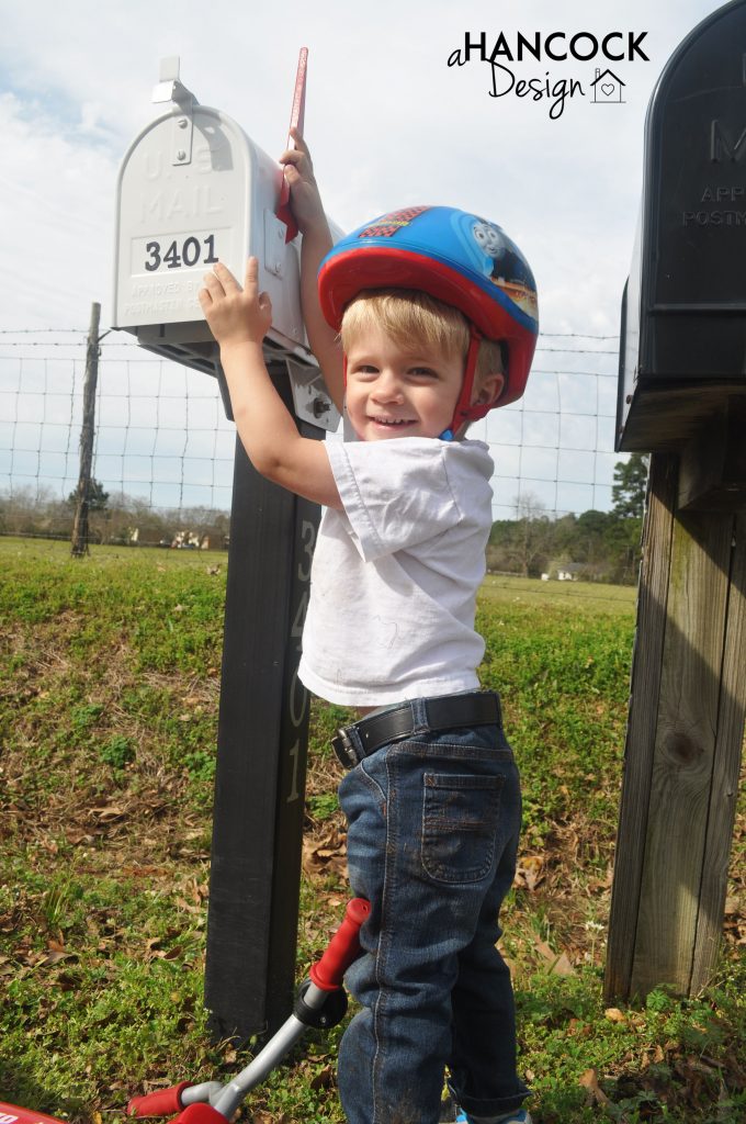 Cute kid by mailbox